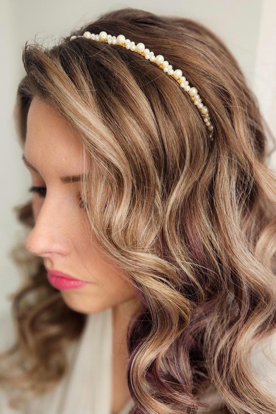 Model with textured waves wearing a thin pearl bridal headband, showcasing a simple yet elegant accessory perfect for adding subtle sparkle to any bridal hairstyle. Ideal for understated, romantic wedding looks.
